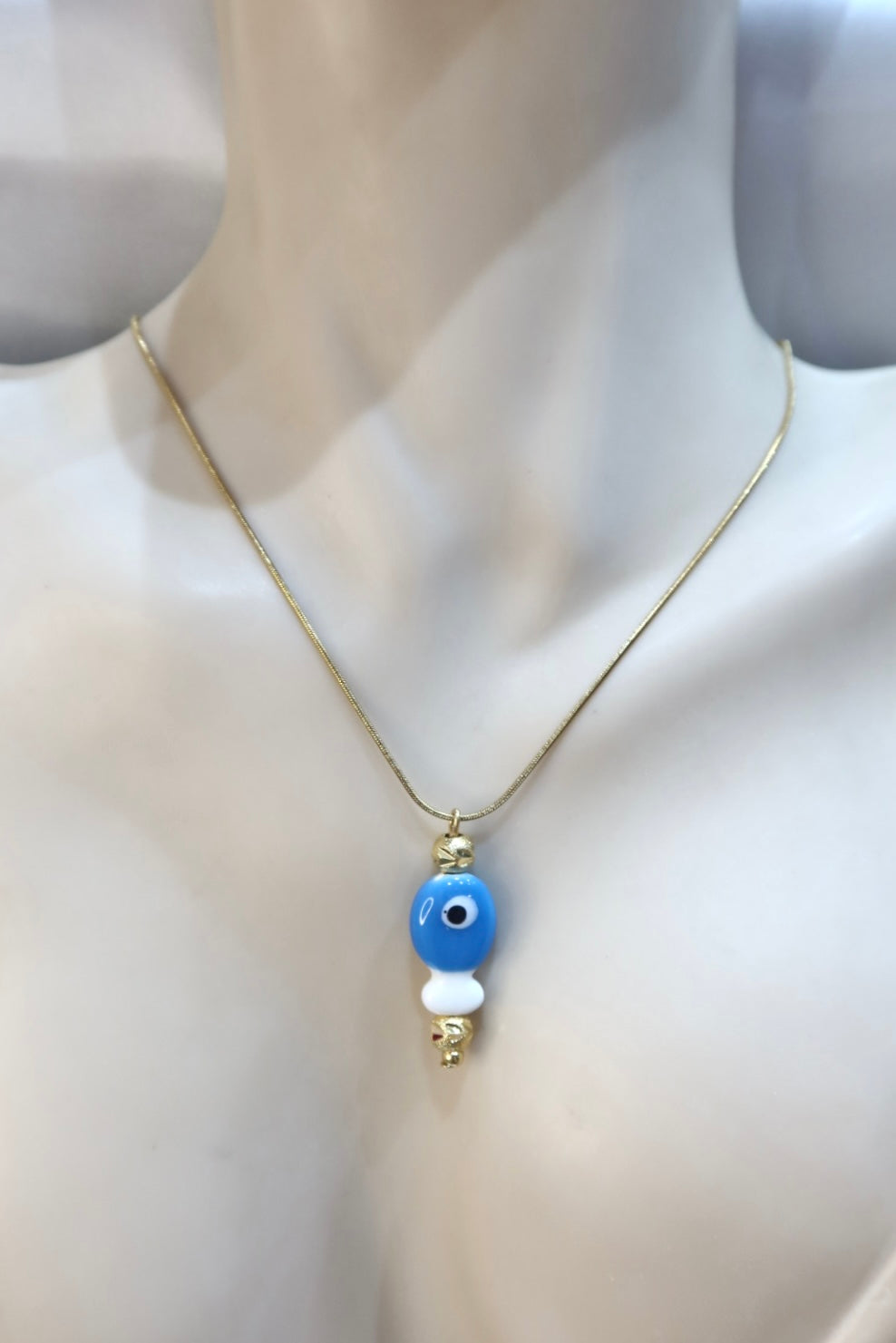 Κολιέ ατσάλι σε χρυσό χρώμα γαλάζιο ψαράκι μάτι